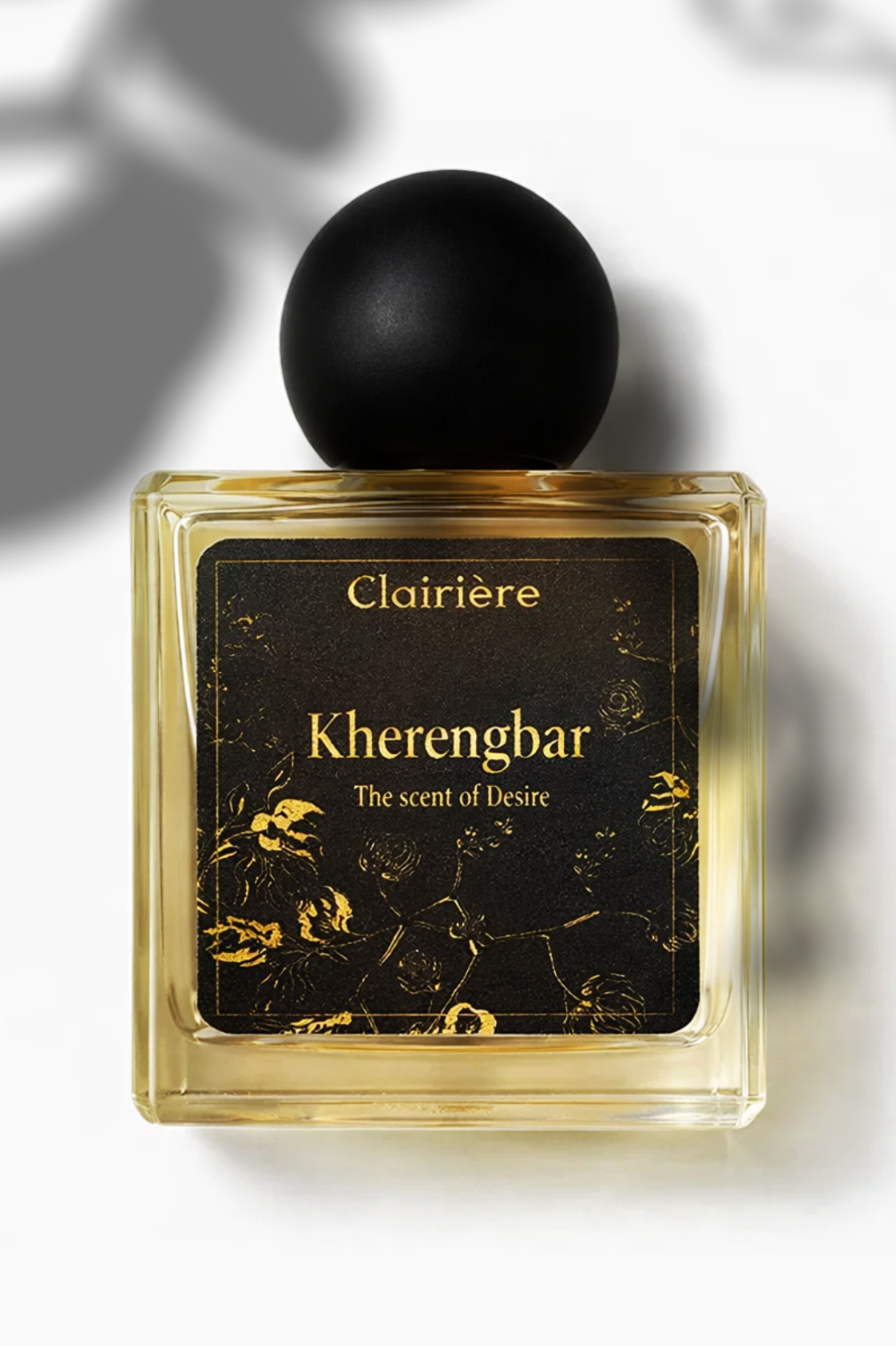Perfume Kherengbar  bottle with black cap and gold label on a white background